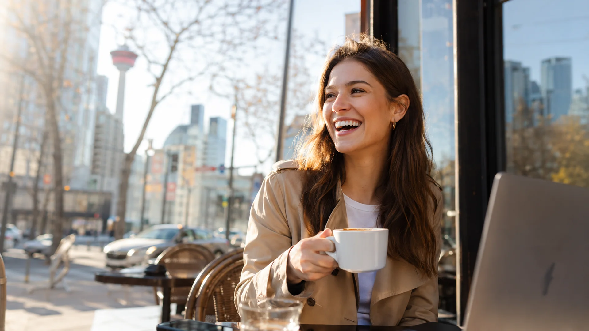 Woman enjoying coffee at a Calgary café patio